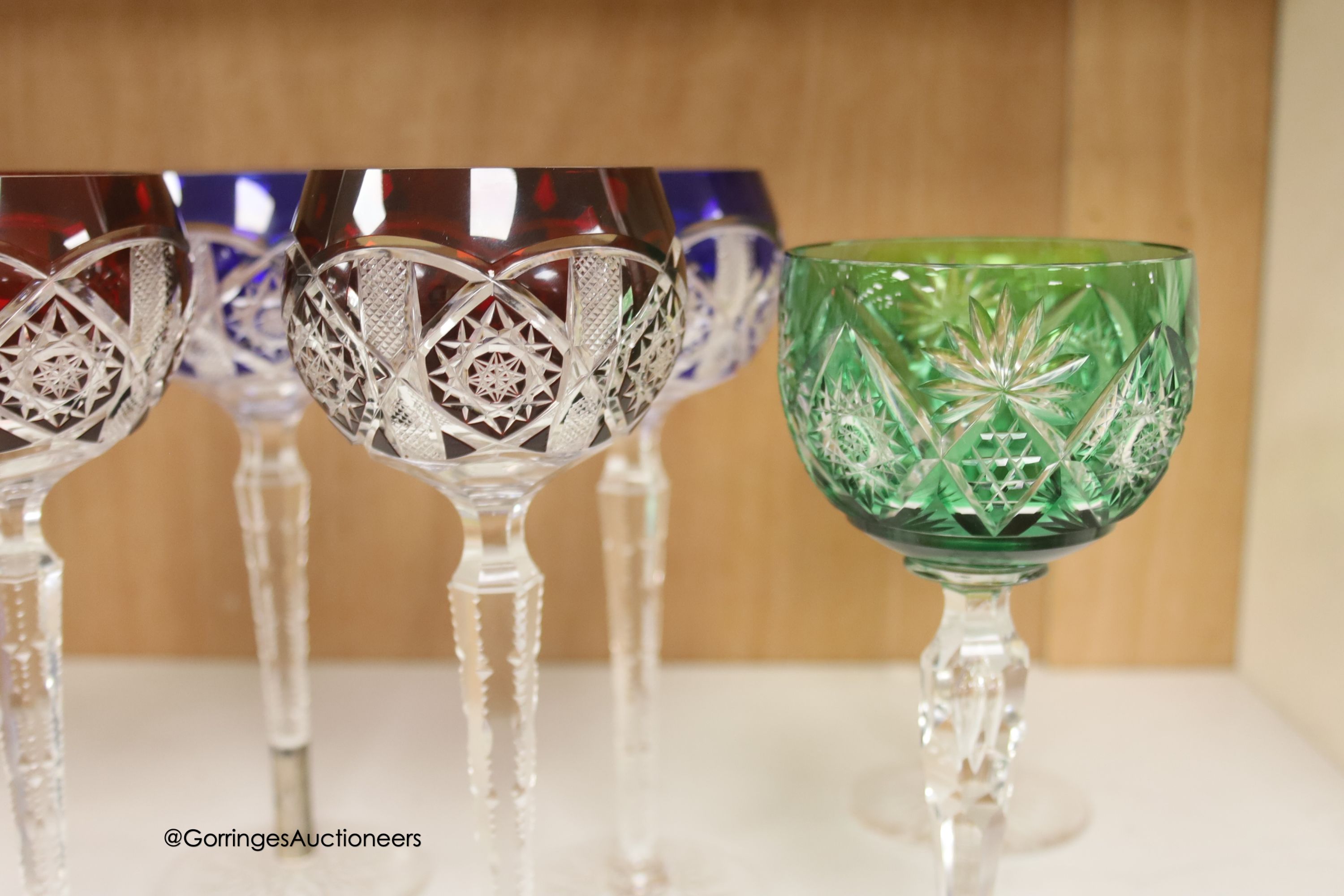 A harlequin collection of flash cut hock glasses, 19th century and later, tallest 21cm